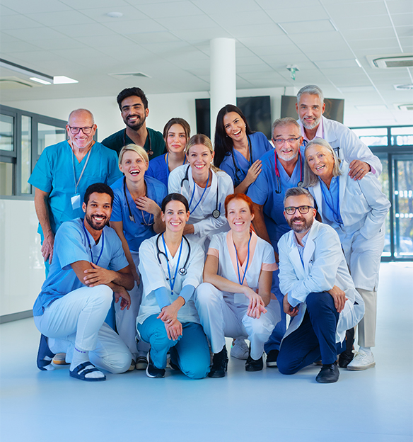 Portrait of happy doctors, nurses and other medical staff in hospital.